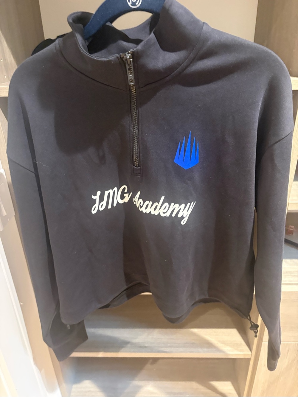 Under Armour Black Quarter-Zip Pullover with Blue Crest and White Script